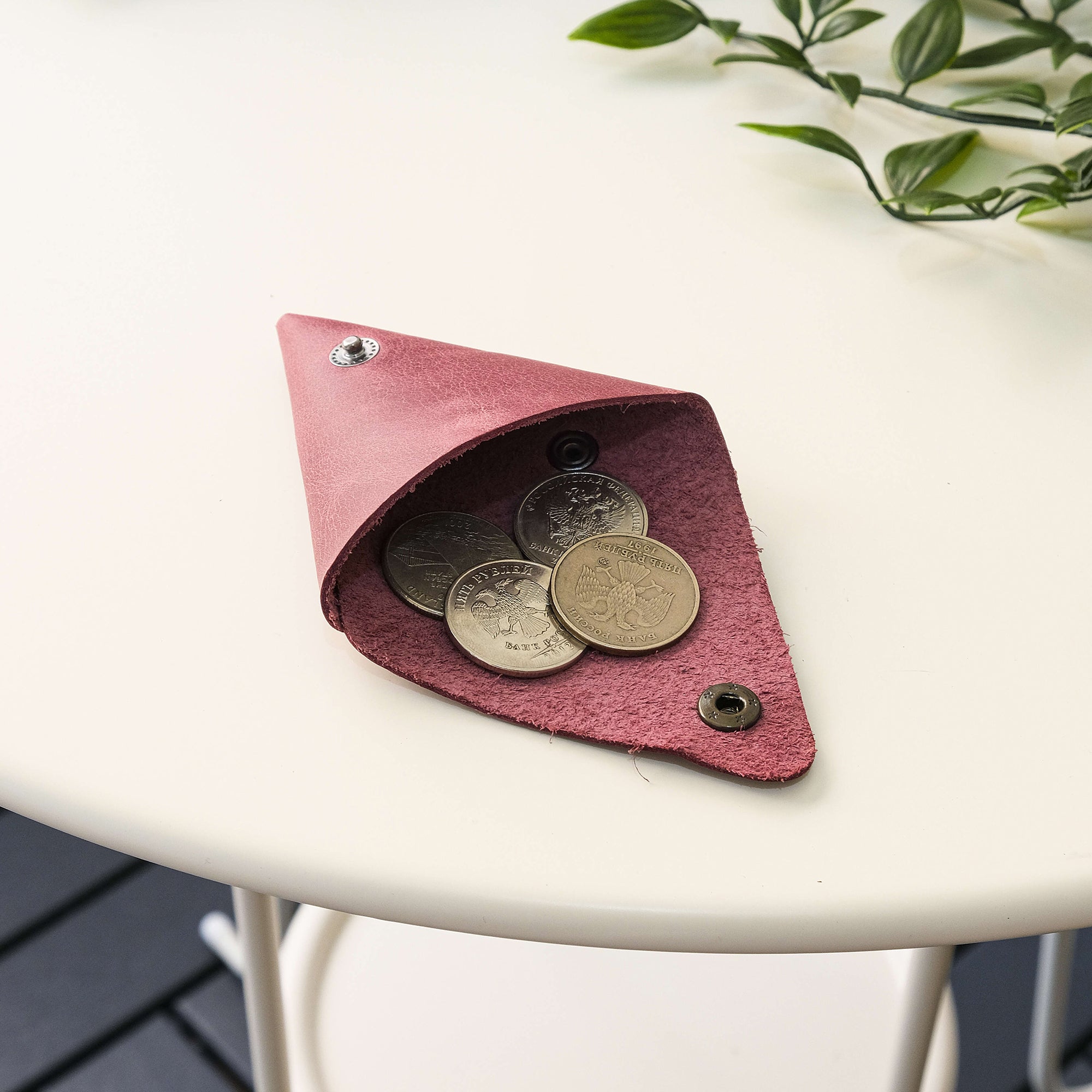 Bamby Genuine Leather Coin Pouch in various colors, showcasing its minimalist and stitchless design.