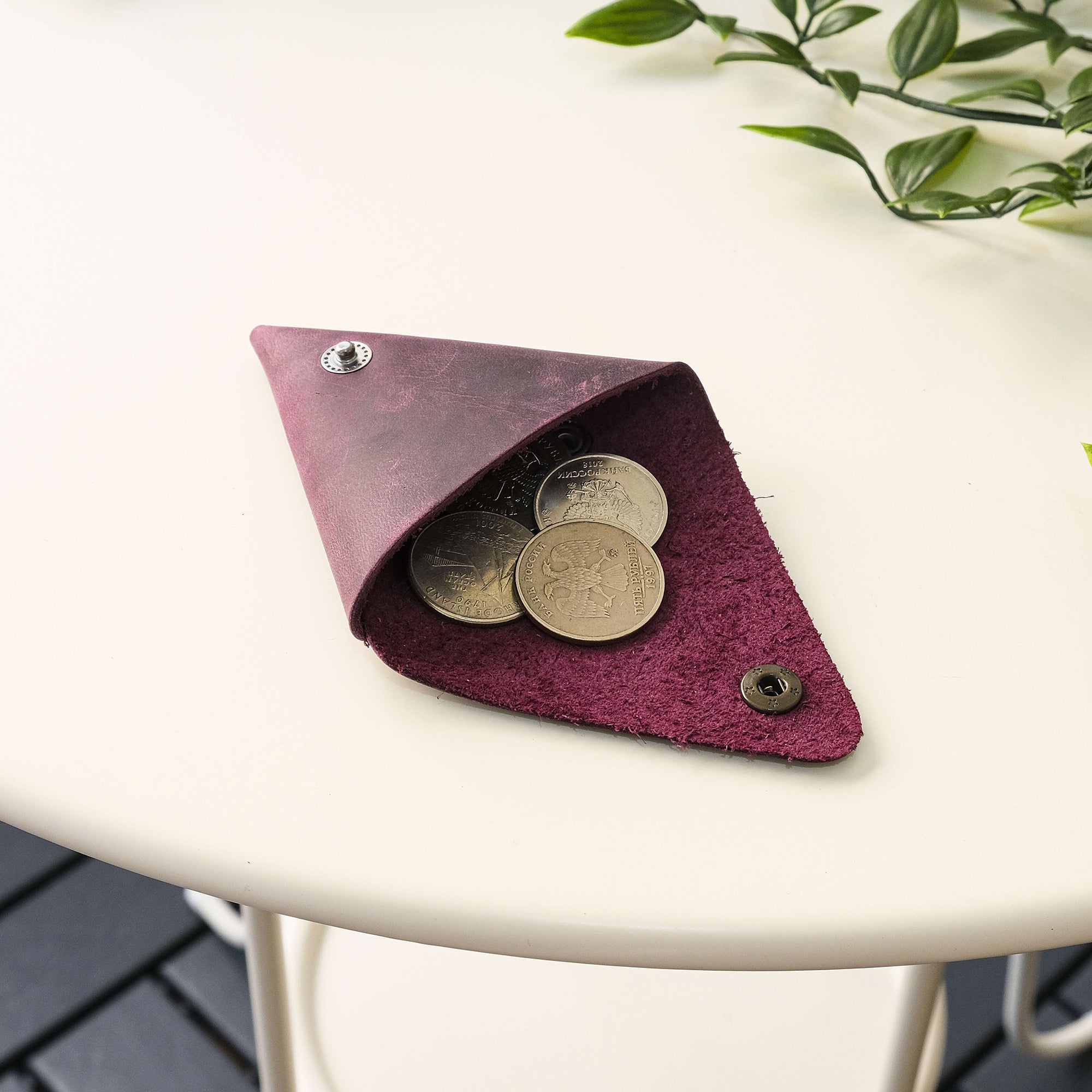 Bamby Genuine Leather Coin Pouch in various colors, showcasing its minimalist and stitchless design.