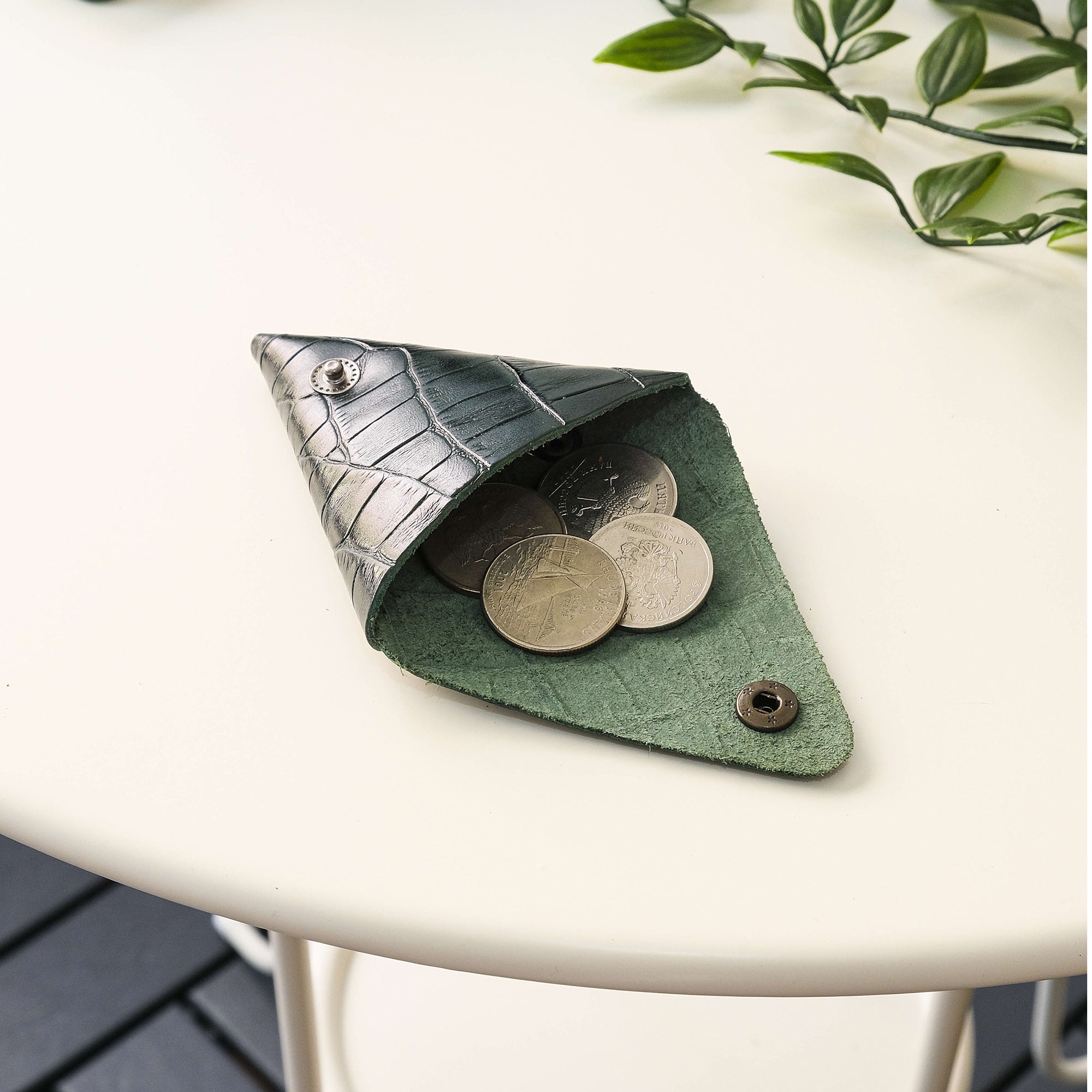 Bamby Genuine Leather Coin Pouch in various colors, showcasing its minimalist and stitchless design.
