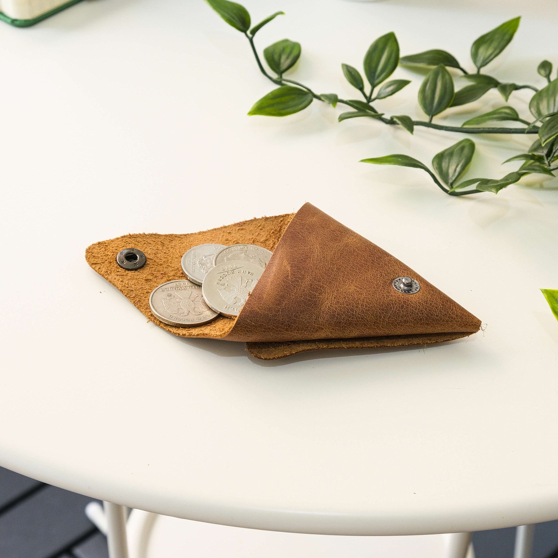 Bamby Genuine Leather Coin Pouch in various colors, showcasing its minimalist and stitchless design.