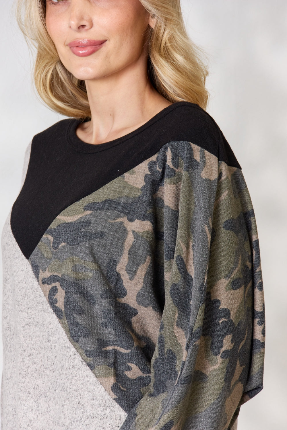 BiBi Brushed Hacci Color Block Long Sleeve Top featuring a soft fabric, modern color block design, and camouflage French terry accents.
