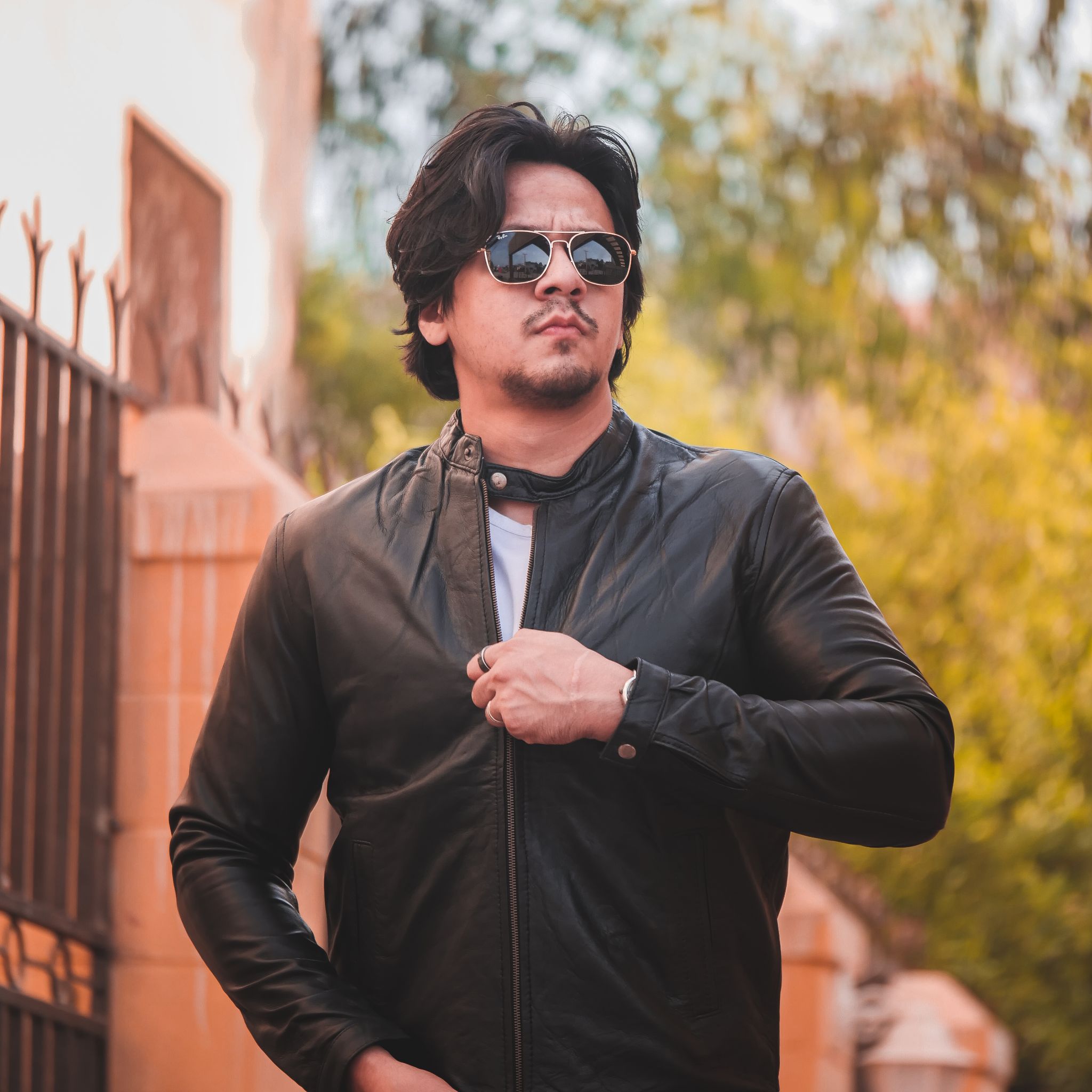 Black mens pure sheep leather zipper jacket with a modern fit and snap button collar, showcasing premium craftsmanship and stylish design.