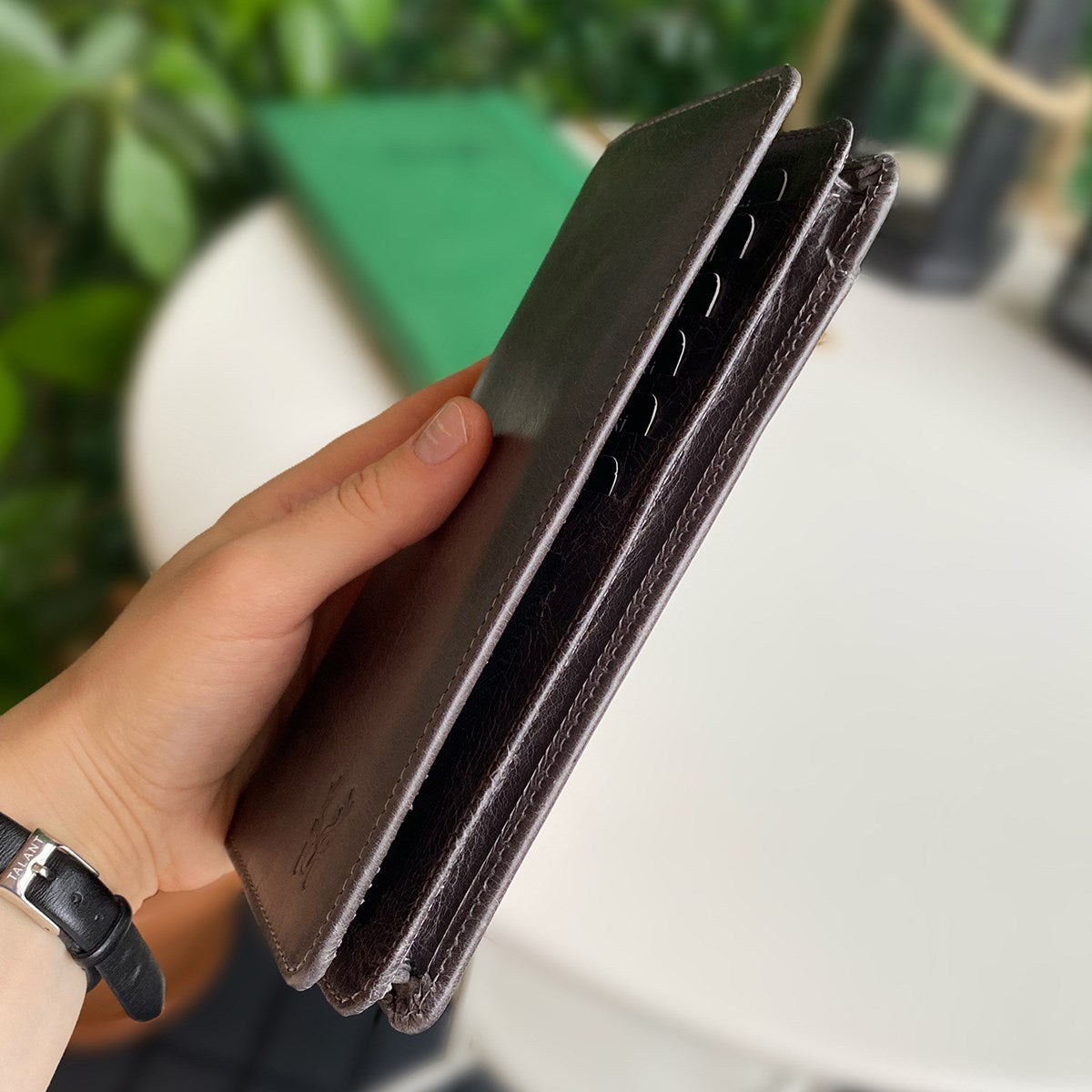 Boston Genuine Leather Wallet featuring a phone socket and multiple compartments in a stylish design.