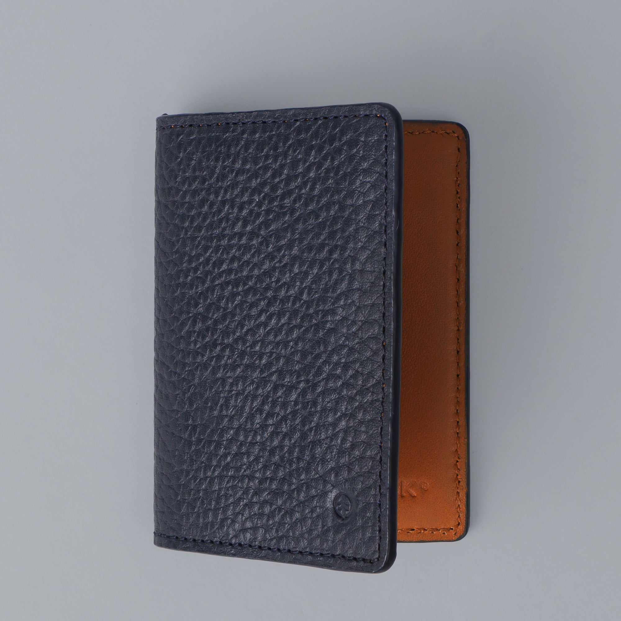 A sleek Business Cards Leather Wallet made from premium full grain leather, featuring multiple pockets for business cards, showcasing its elegant design.
