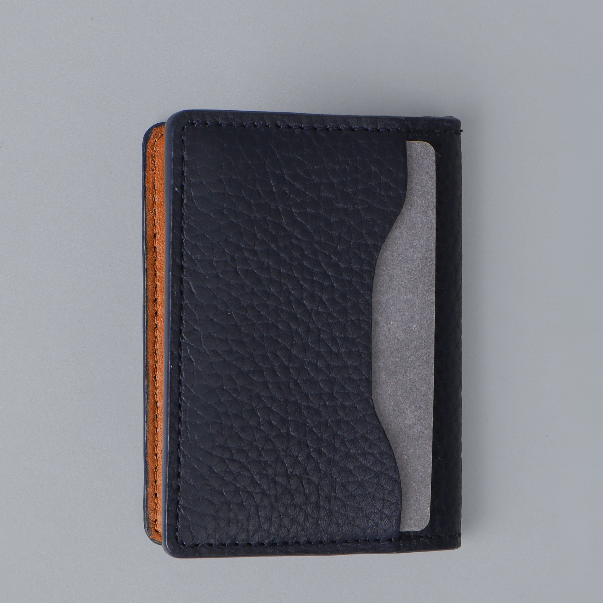A sleek Business Cards Leather Wallet made from premium full grain leather, featuring multiple pockets for business cards, showcasing its elegant design.