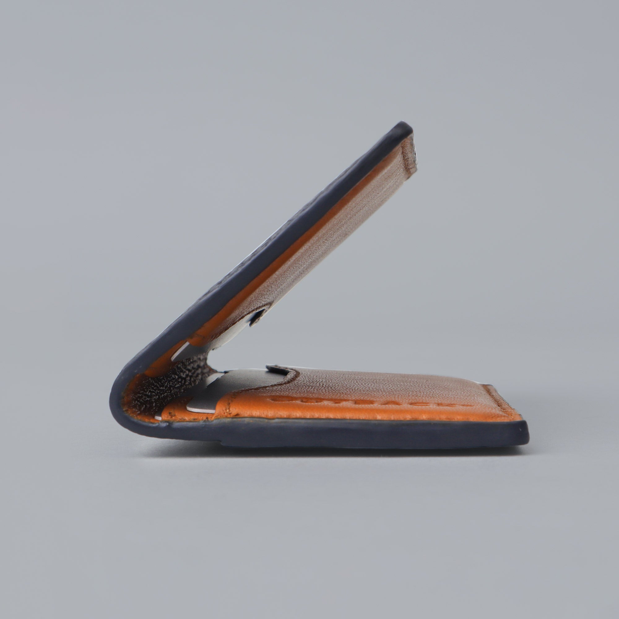 A sleek Business Cards Leather Wallet made from premium full grain leather, featuring multiple pockets for business cards, showcasing its elegant design.