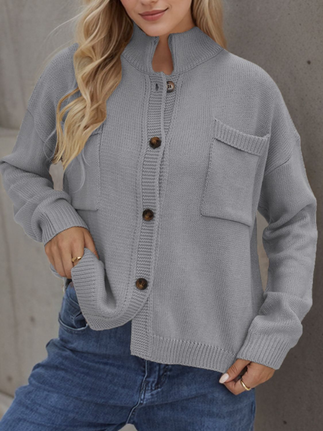 A stylish Button Up Long Sleeve Cardigan in a cozy fabric, featuring buttons and pockets, perfect for layering in cooler weather.