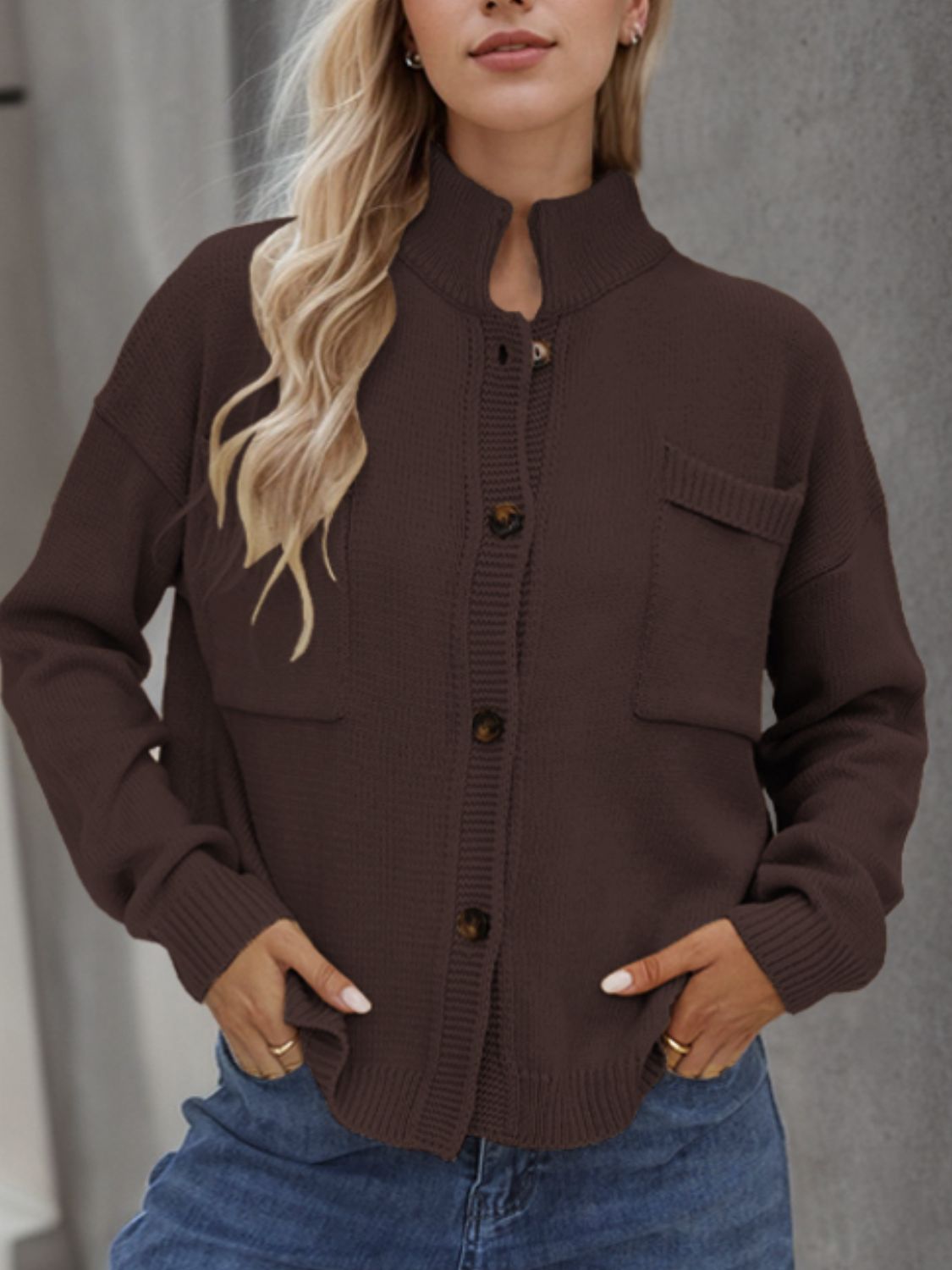 A stylish Button Up Long Sleeve Cardigan in a cozy fabric, featuring buttons and pockets, perfect for layering in cooler weather.