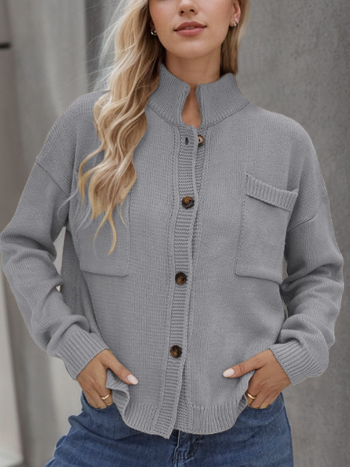 A stylish Button Up Long Sleeve Cardigan in a cozy fabric, featuring buttons and pockets, perfect for layering in cooler weather.