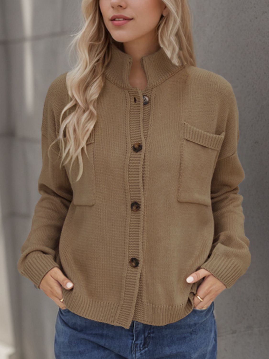 A stylish Button Up Long Sleeve Cardigan in a cozy fabric, featuring buttons and pockets, perfect for layering in cooler weather.