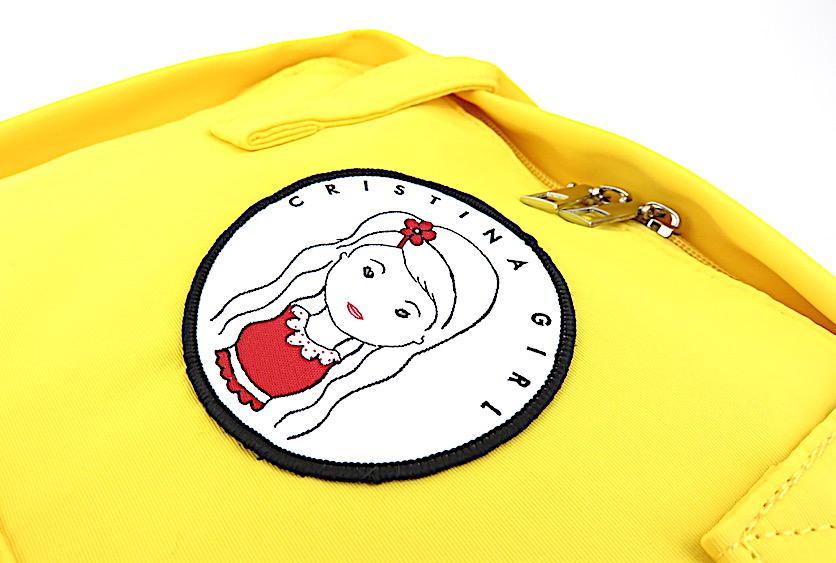 Stylish Carry-All Bag with Laptop Pocket in waterproof nylon, featuring adjustable straps and zipped front pocket.