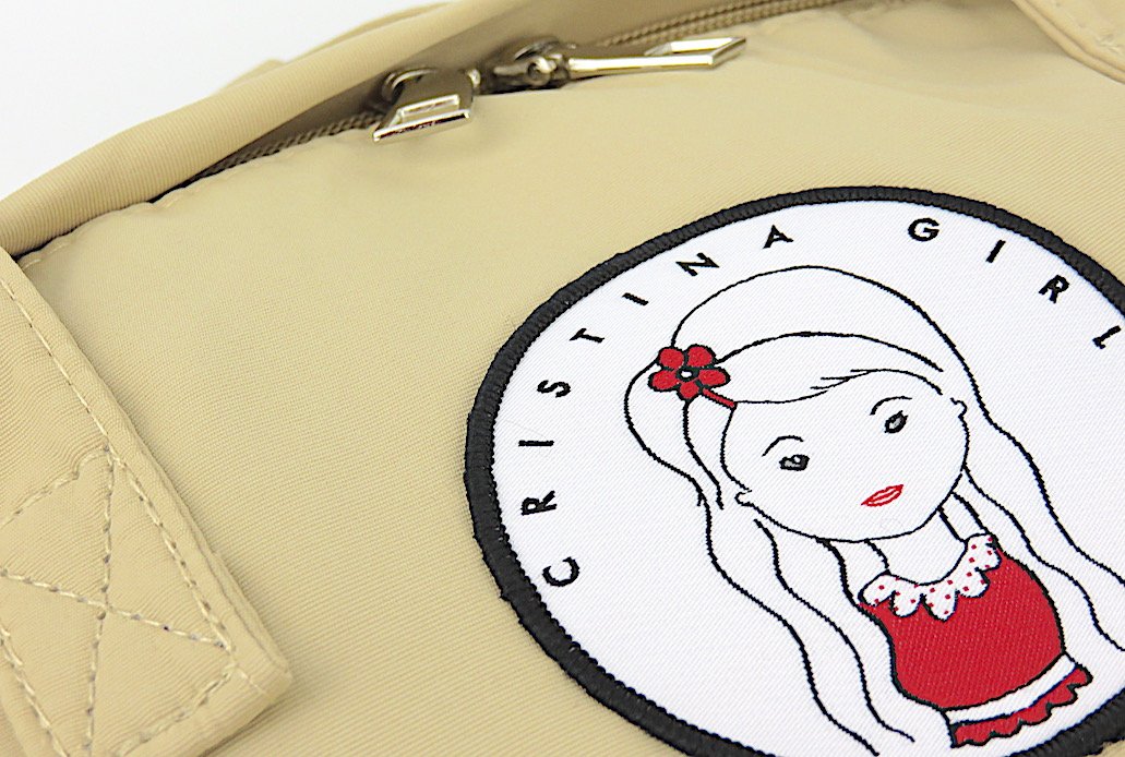 Stylish Carry-All Bag with Laptop Pocket in waterproof nylon, featuring adjustable straps and zipped front pocket.