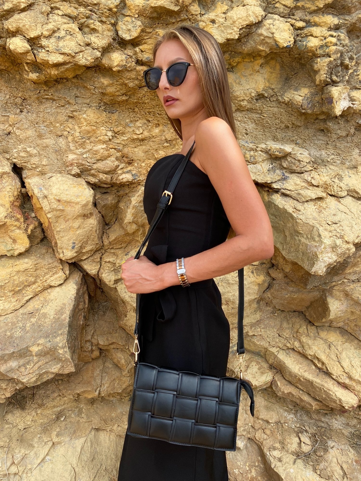 Stylish black Cassette Shoulder Bag with quilted flap and adjustable strap, showcasing its elegant design and functional features.