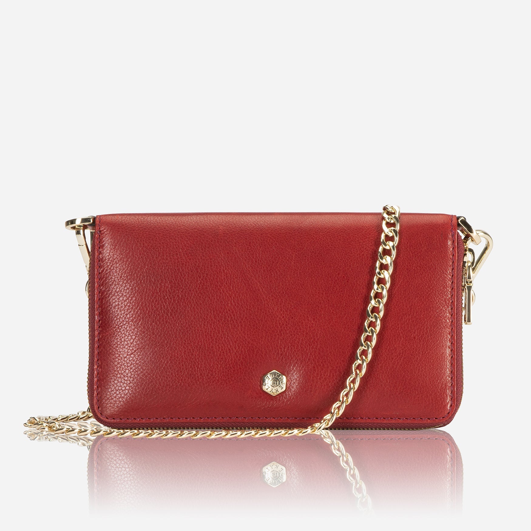 A stylish red chain purse hanging elegantly, showcasing its vibrant color and eye-catching design.