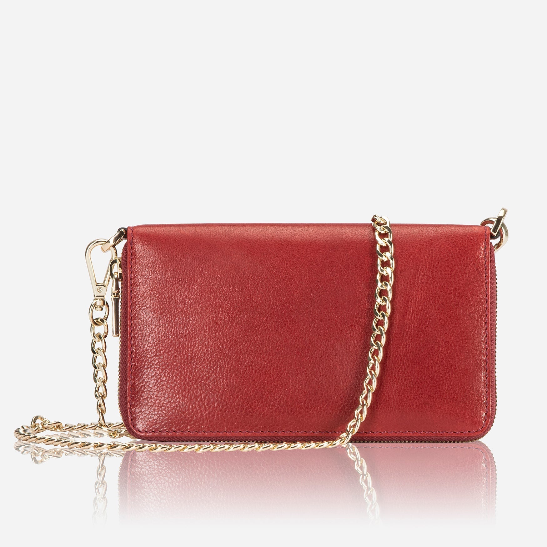 A stylish red chain purse hanging elegantly, showcasing its vibrant color and eye-catching design.