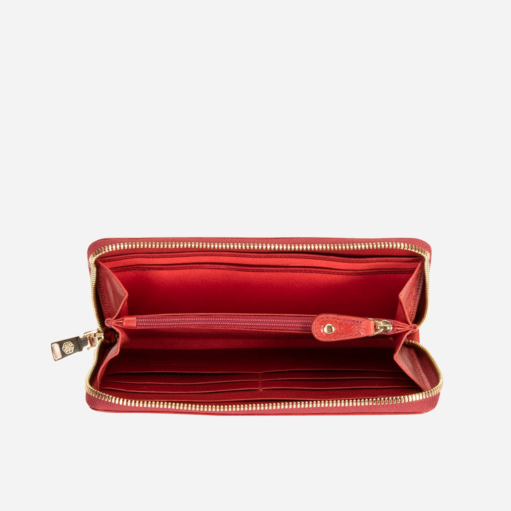 A stylish red chain purse hanging elegantly, showcasing its vibrant color and eye-catching design.