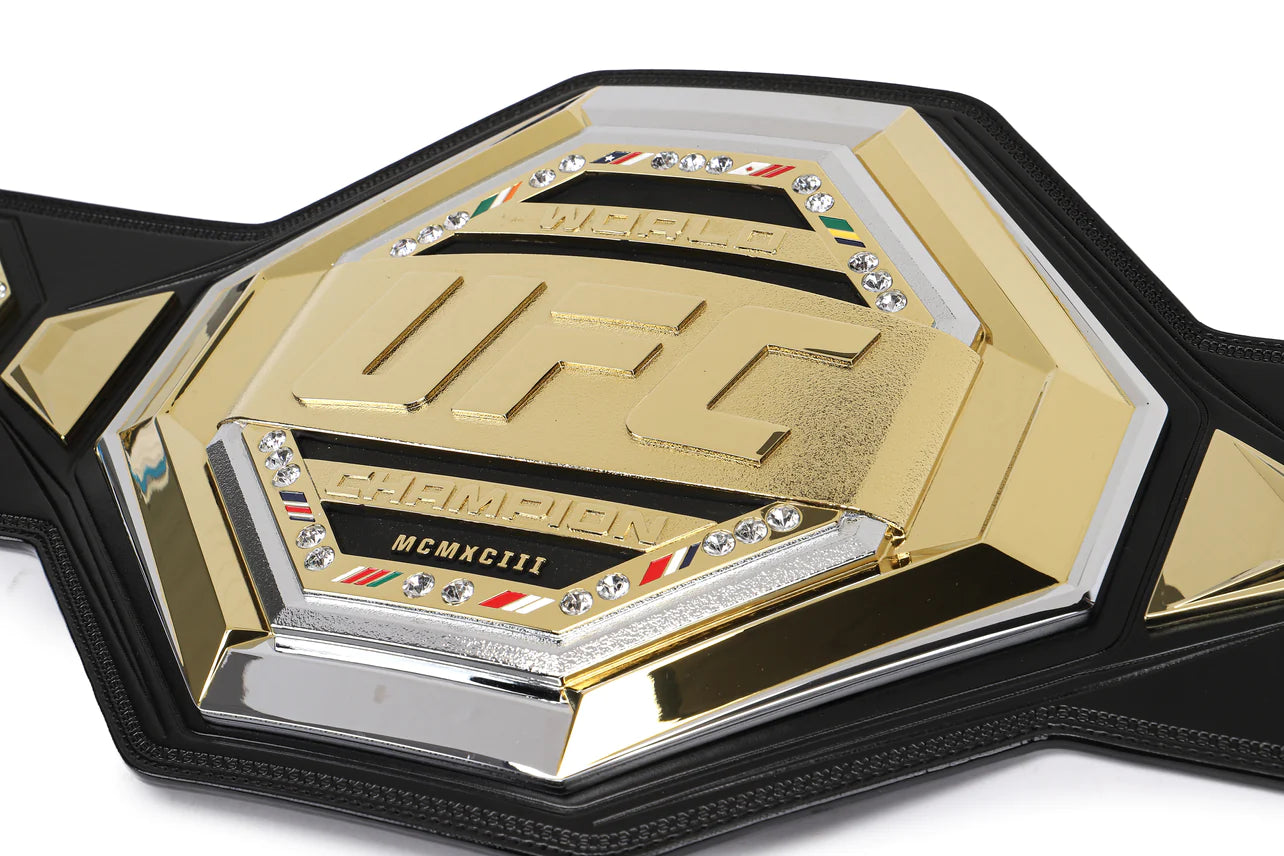 CHARLES OLIVEIRA SIGNED UFC LEGACY CHAMPIONSHIP REPLICA BELT featuring Charles Oliveira's autograph, showcasing intricate details and design.