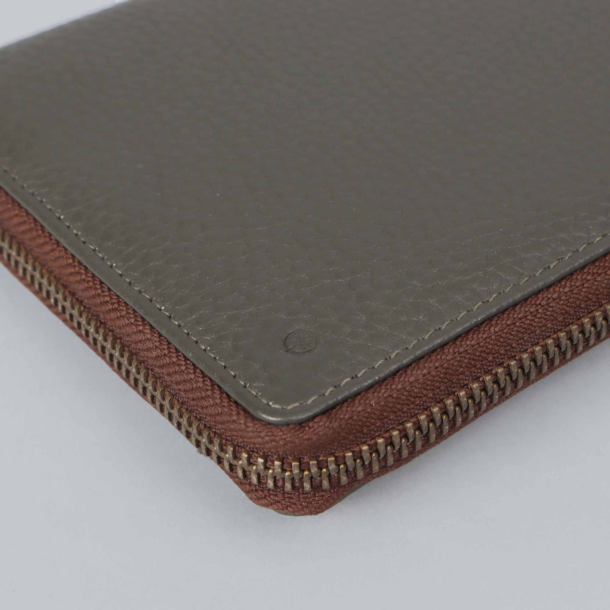 A stylish Cheque Book Leather Wallet made from premium full grain leather, featuring multiple pockets and a secure zipper closure.