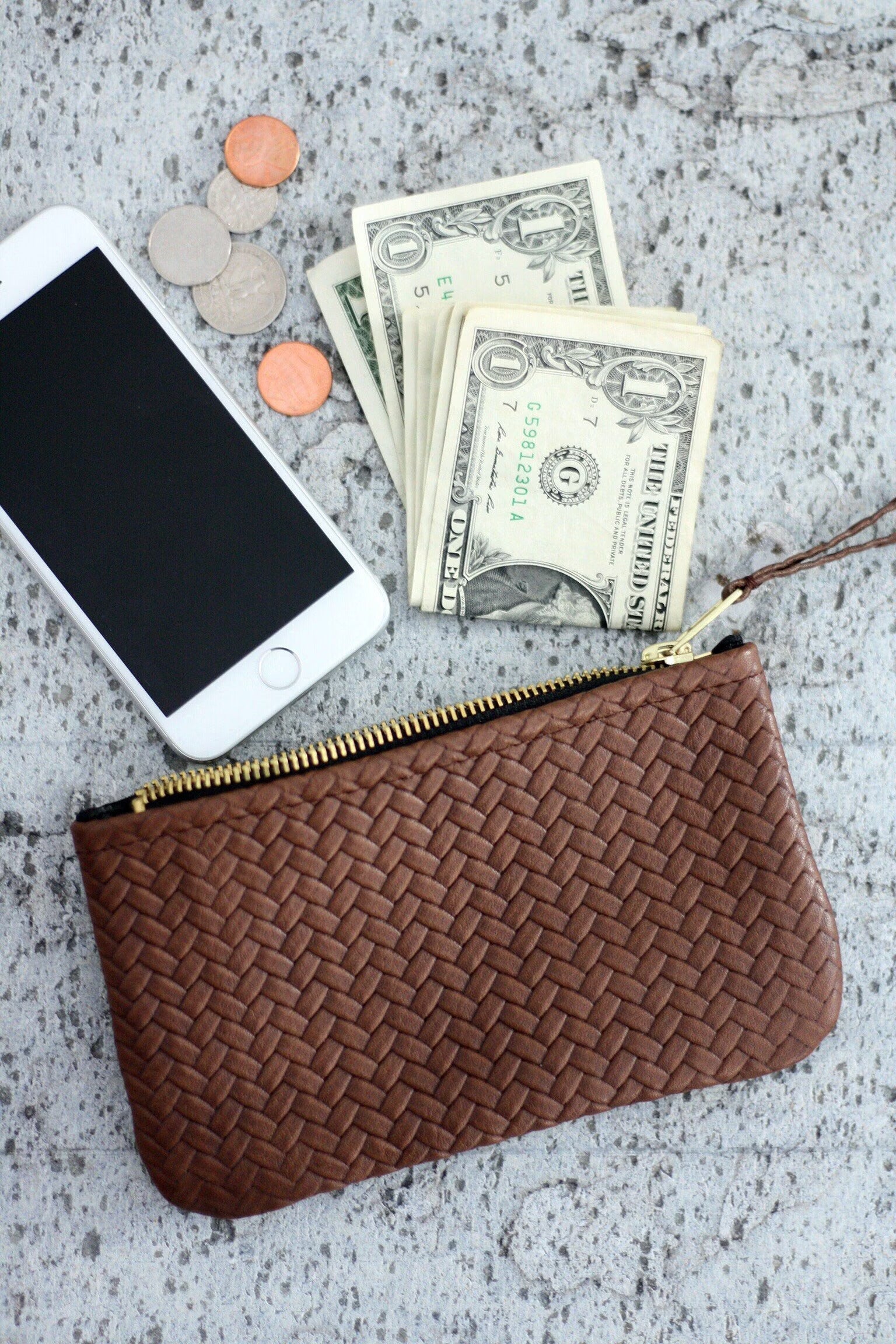 Coffer Mini Handwoven Leather Zipper Clutch in Tan Brown, showcasing its handwoven texture and compact design.