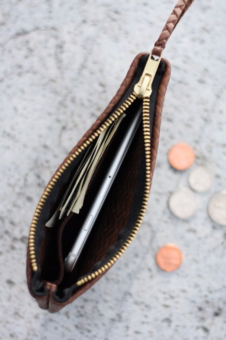 Coffer Mini Handwoven Leather Zipper Clutch in Tan Brown, showcasing its handwoven texture and compact design.