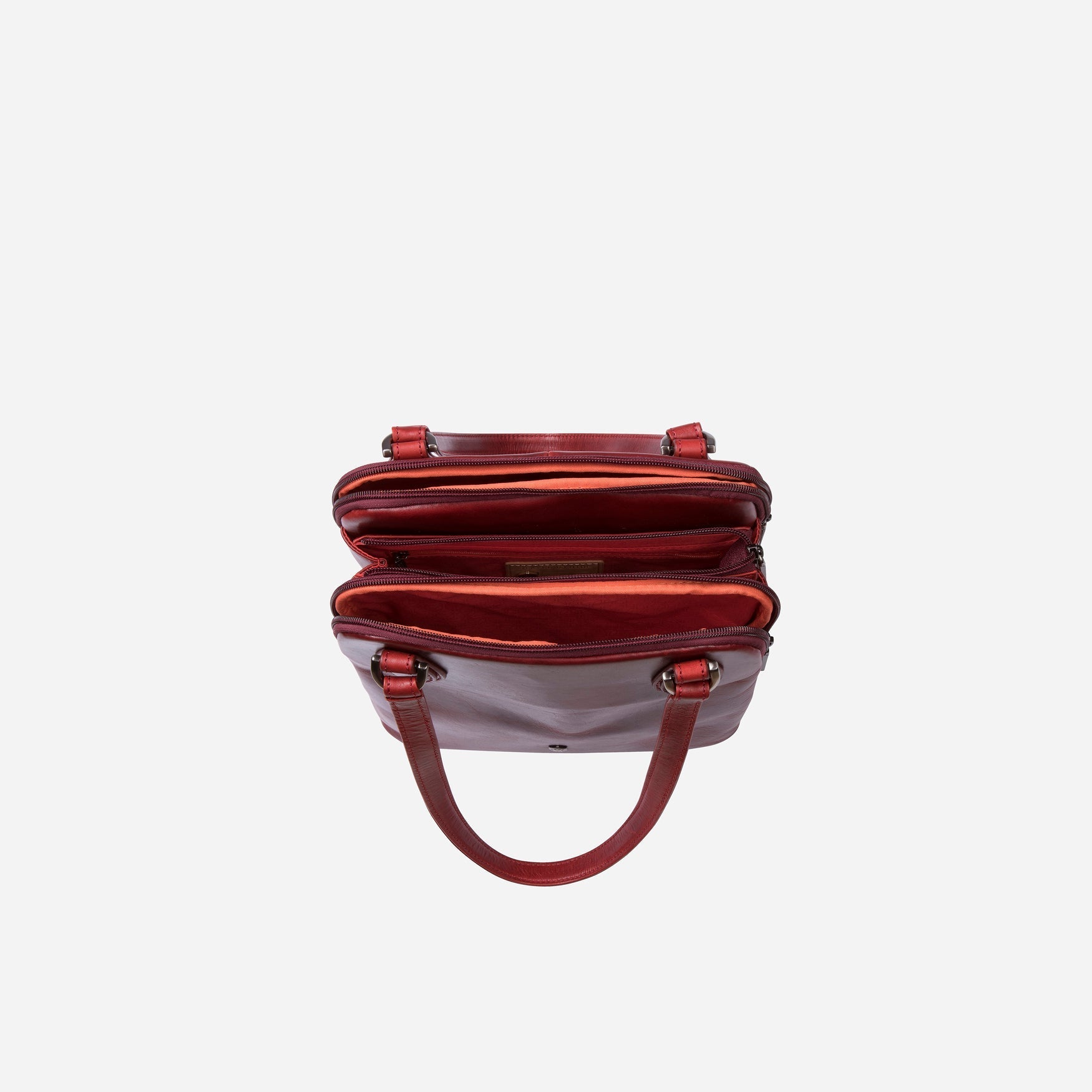 Compact Ladies Handbag in Rust, showcasing its elegant design and spacious interior for essentials.