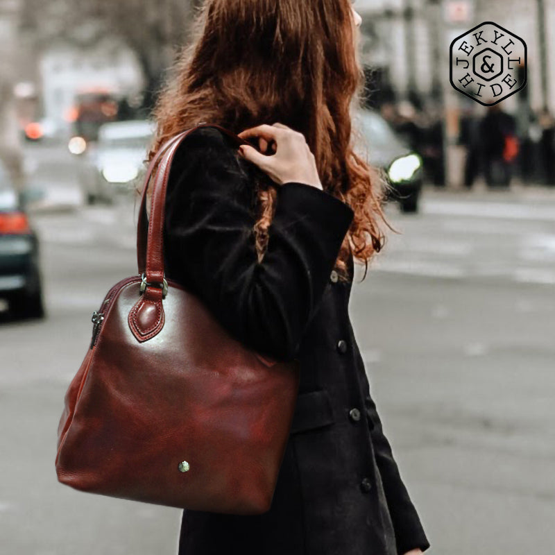Compact Ladies Handbag in Rust, showcasing its elegant design and spacious interior for essentials.
