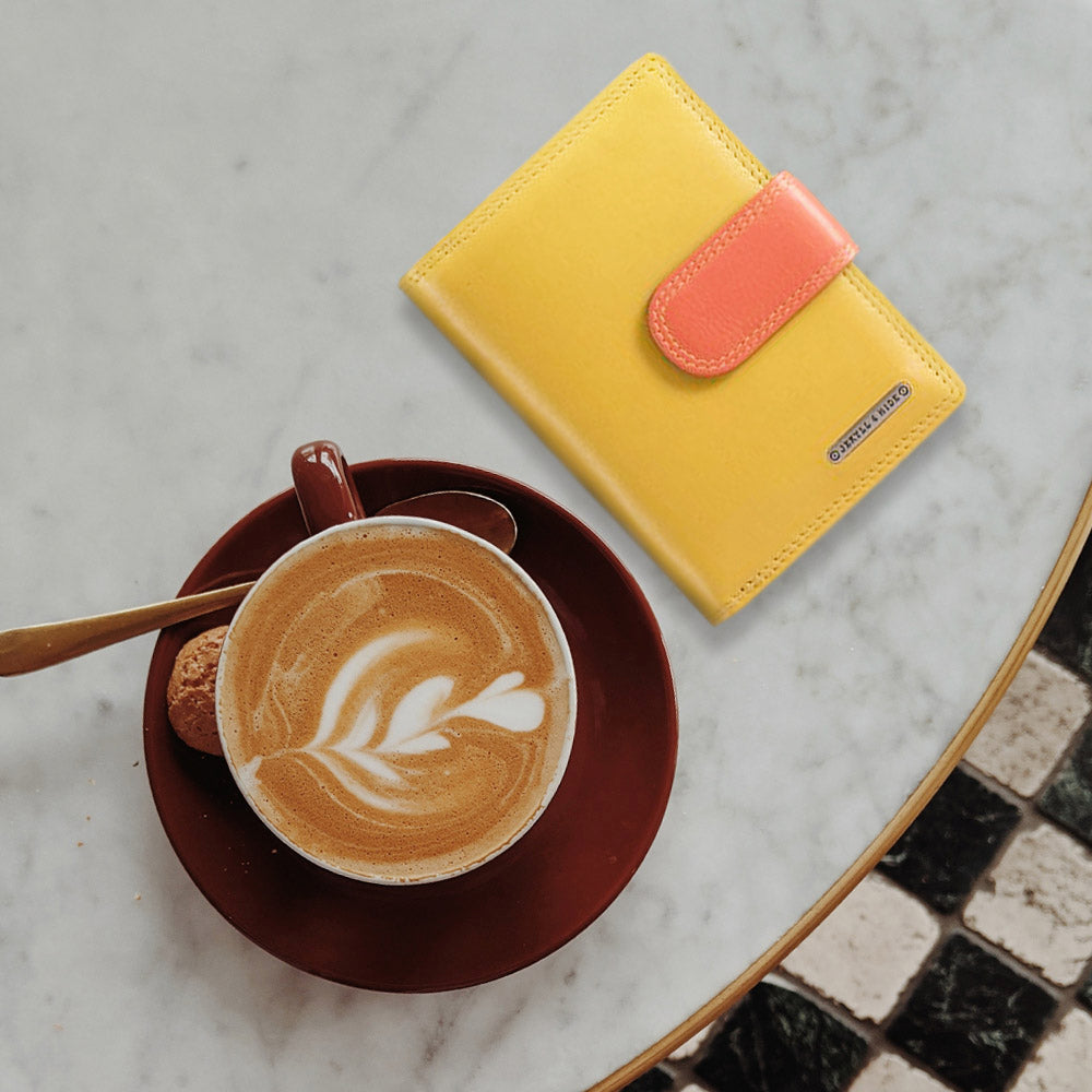 Compact Ladies Purse in vibrant Caribbean colors with a press-stud closure, showcasing its stylish and functional design.