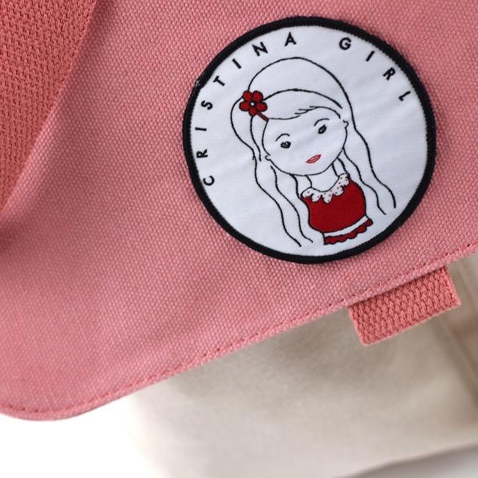 Stylish two-tone cross body bag made of durable canvas, featuring adjustable strap and multiple pockets.