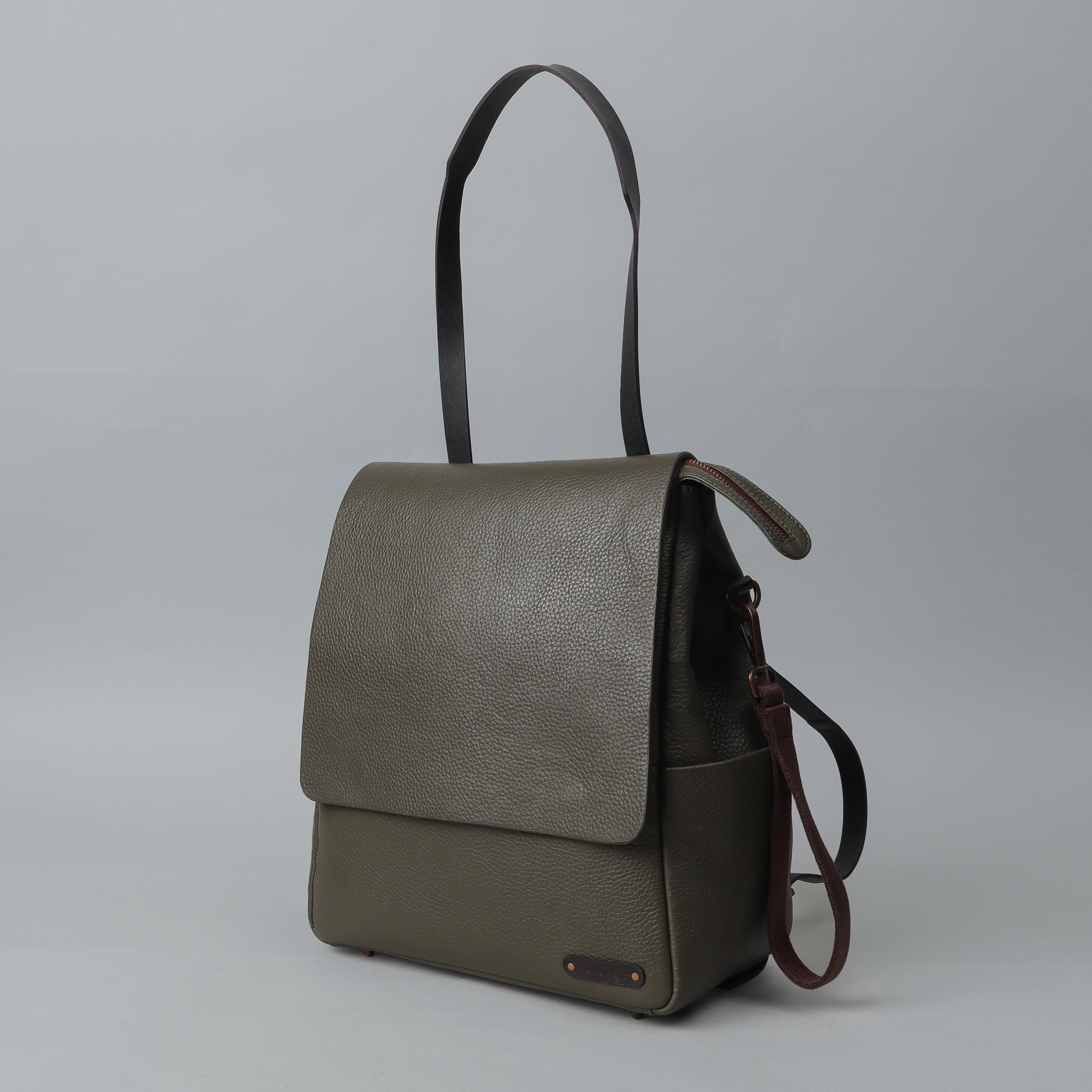 Donna Leather Diaper Bag in premium full grain leather with multiple pockets and versatile carrying options.