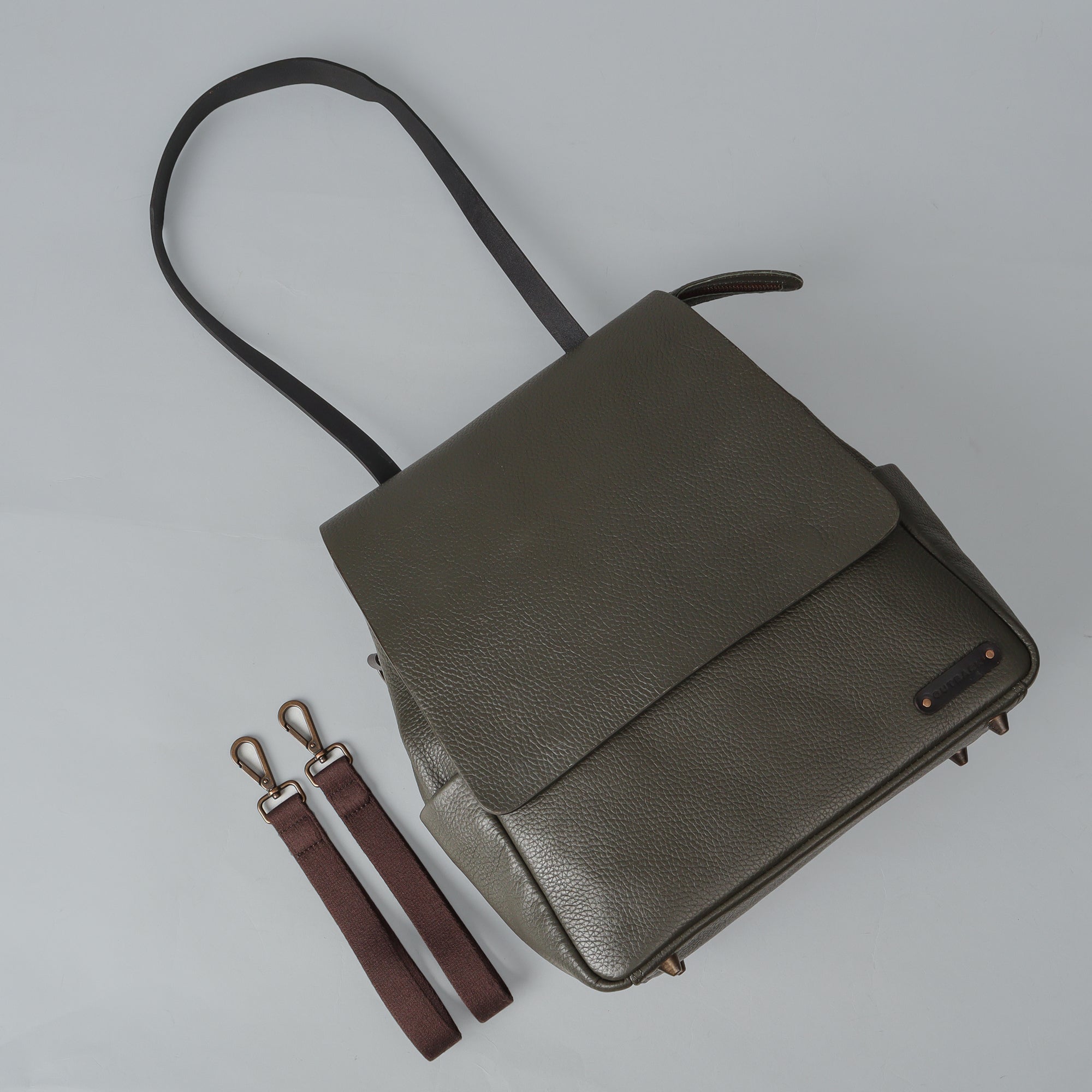 Donna Leather Diaper Bag in premium full grain leather with multiple pockets and versatile carrying options.