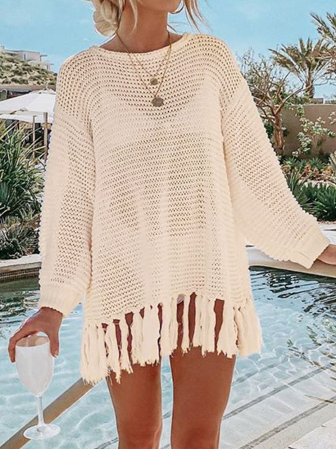 Double Take Openwork Tassel Hem Long Sleeve Knit Cover Up featuring an openwork design and playful tassel hem.