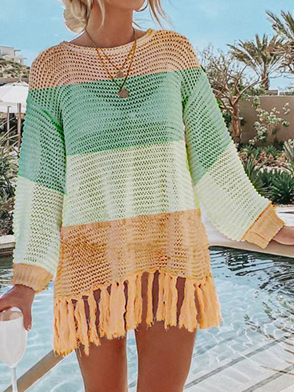 Double Take Openwork Tassel Hem Long Sleeve Knit Cover Up featuring an openwork design and playful tassel hem.