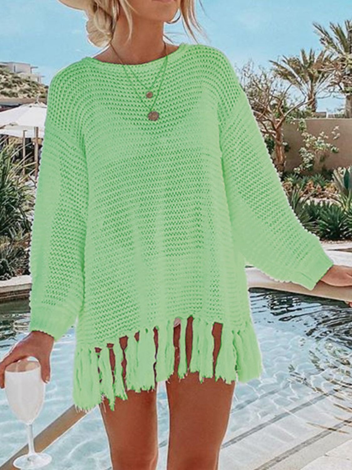 Double Take Openwork Tassel Hem Long Sleeve Knit Cover Up featuring an openwork design and playful tassel hem.