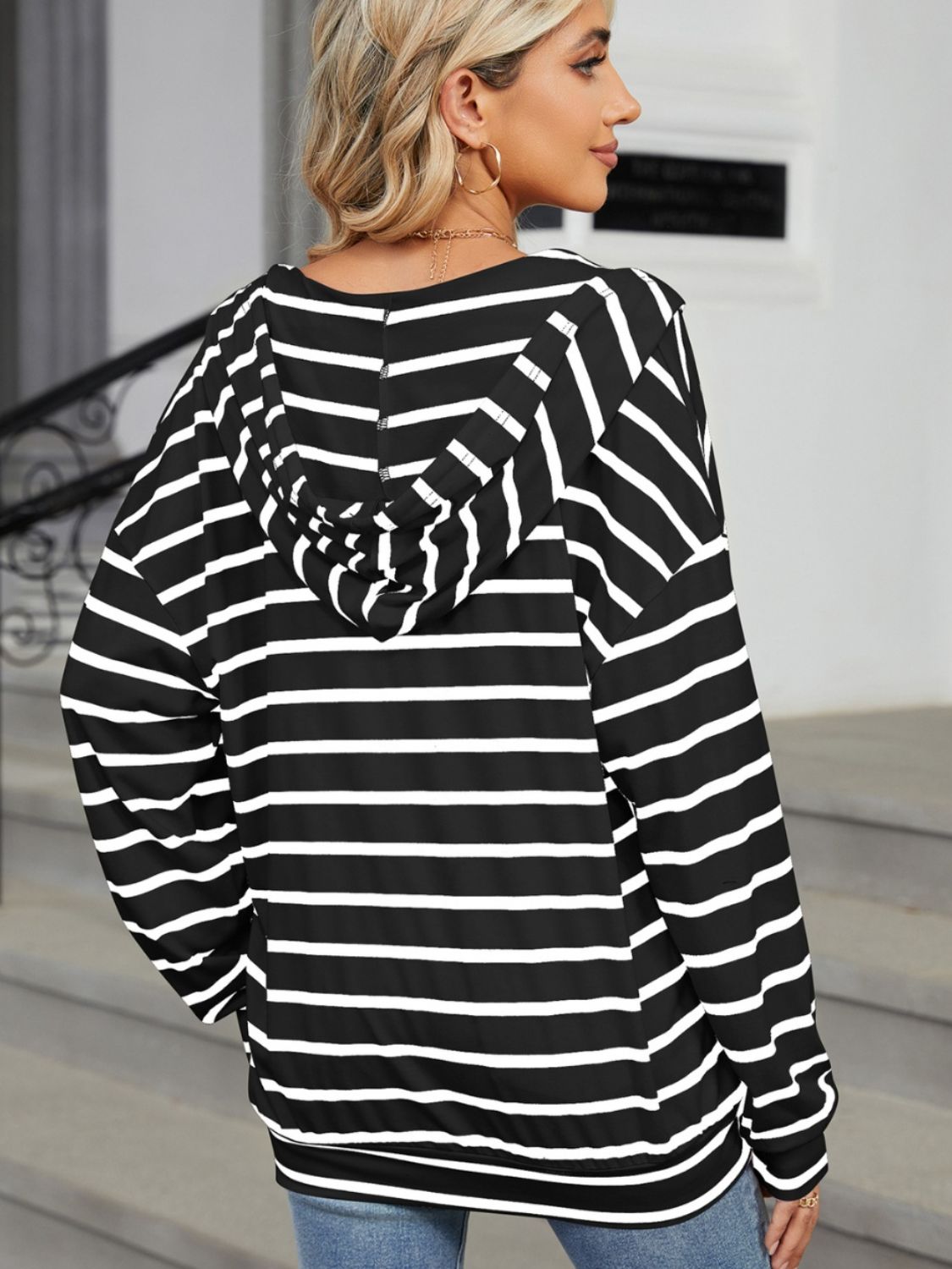 A stylish drawstring striped long sleeve hoodie in various colors, showcasing its soft fabric and adjustable drawstring feature.