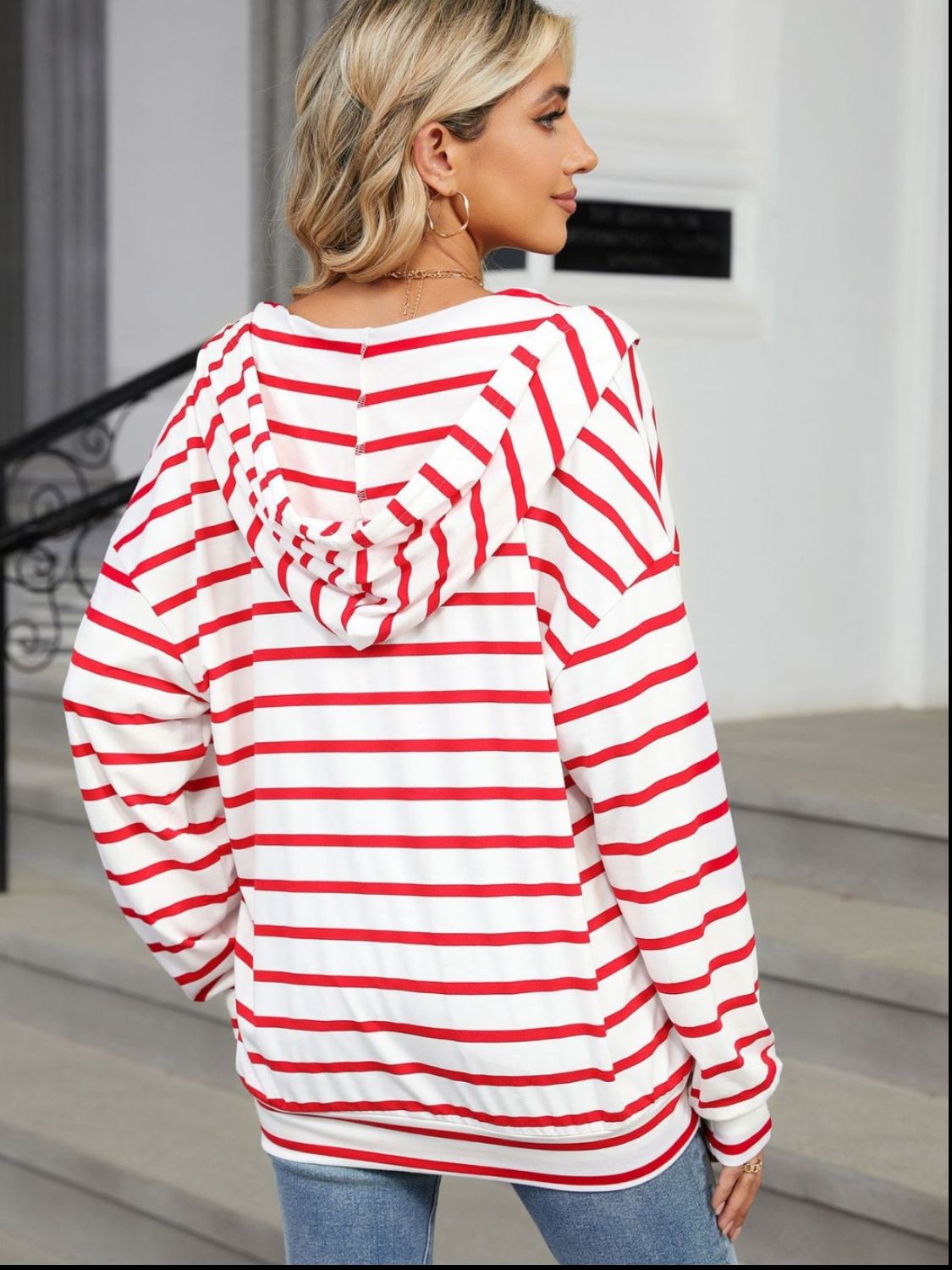A stylish drawstring striped long sleeve hoodie in various colors, showcasing its soft fabric and adjustable drawstring feature.