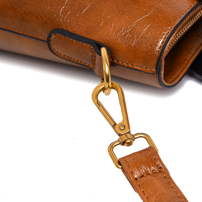 Ethnic Style Flower Pattern Female Messenger Bag featuring a vibrant floral design, medium size, and soft handle for comfortable carrying.