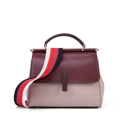 A stylish portable lady's small messenger bag made of two-layer cowhide leather, featuring a trendy splicing design and a wide shoulder strap.