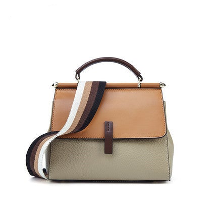 A stylish portable lady's small messenger bag made of two-layer cowhide leather, featuring a trendy splicing design and a wide shoulder strap.