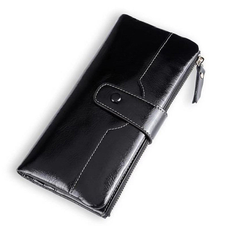 European American style ladies wallet made of soft PU leather with oil wax finish, featuring multiple compartments and a drawstring buckle.
