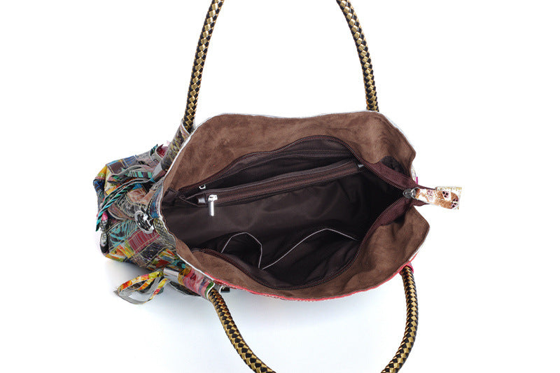 European and American Lady's Portable Striped Handbag featuring a stylish striped design, tassel detail, and durable cowhide material.