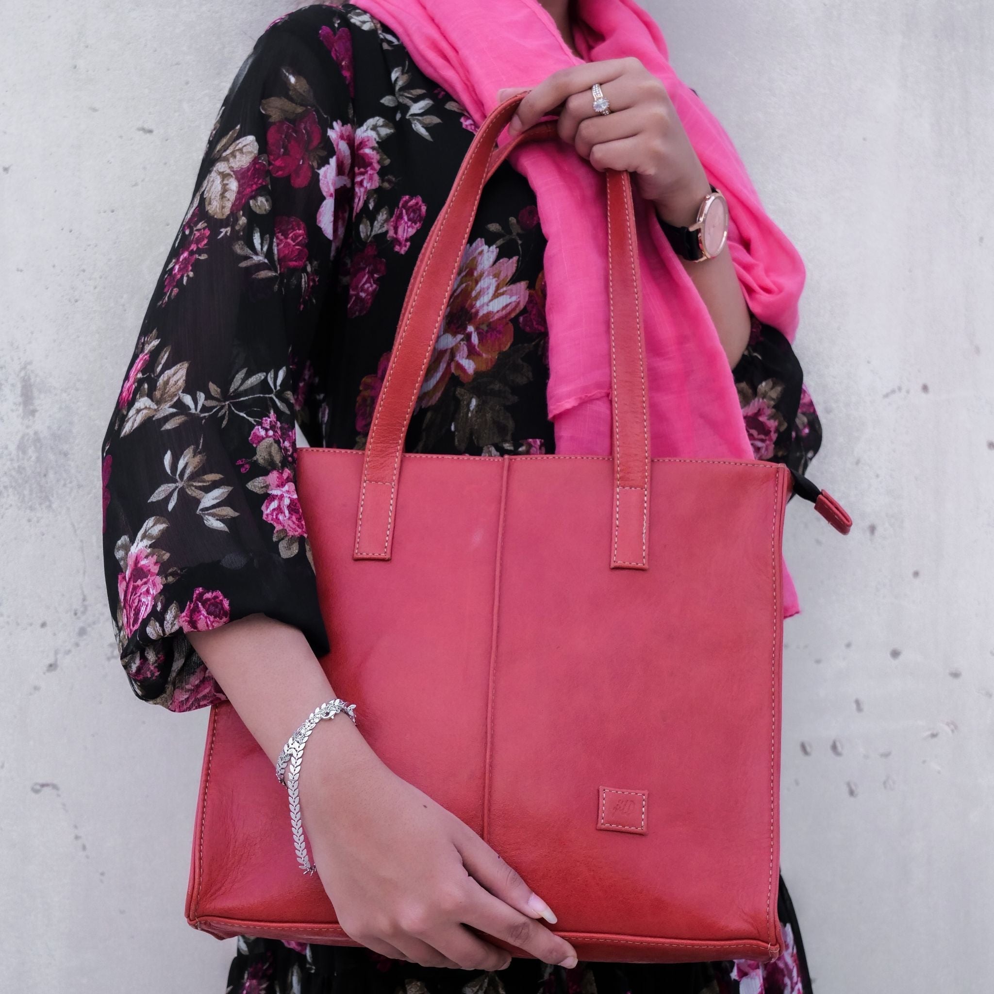 Everyday Women's Leather Zipper Tote Bag in Candy Red, showcasing its spacious design, premium cow leather material, and stylish hardware.