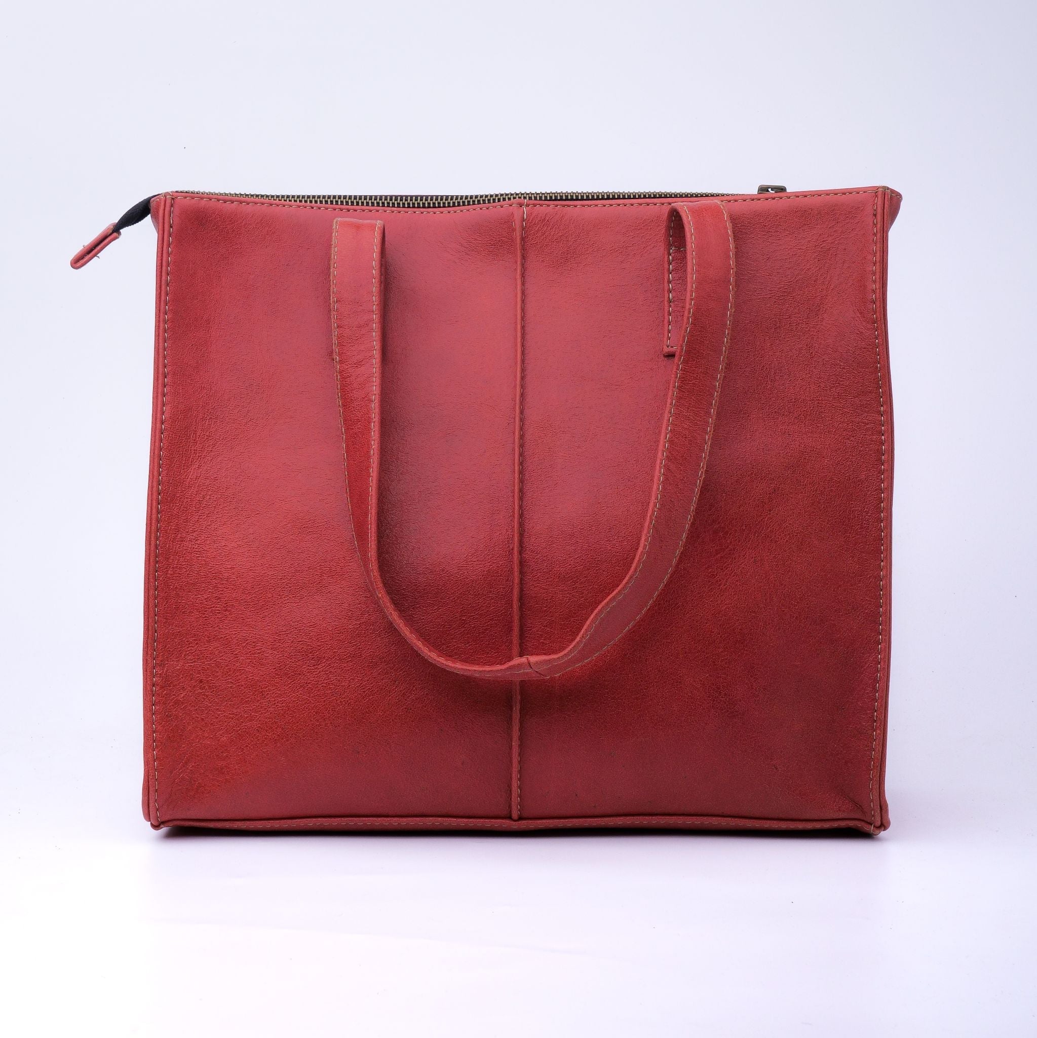 Everyday Women's Leather Zipper Tote Bag in Candy Red, showcasing its spacious design, premium cow leather material, and stylish hardware.