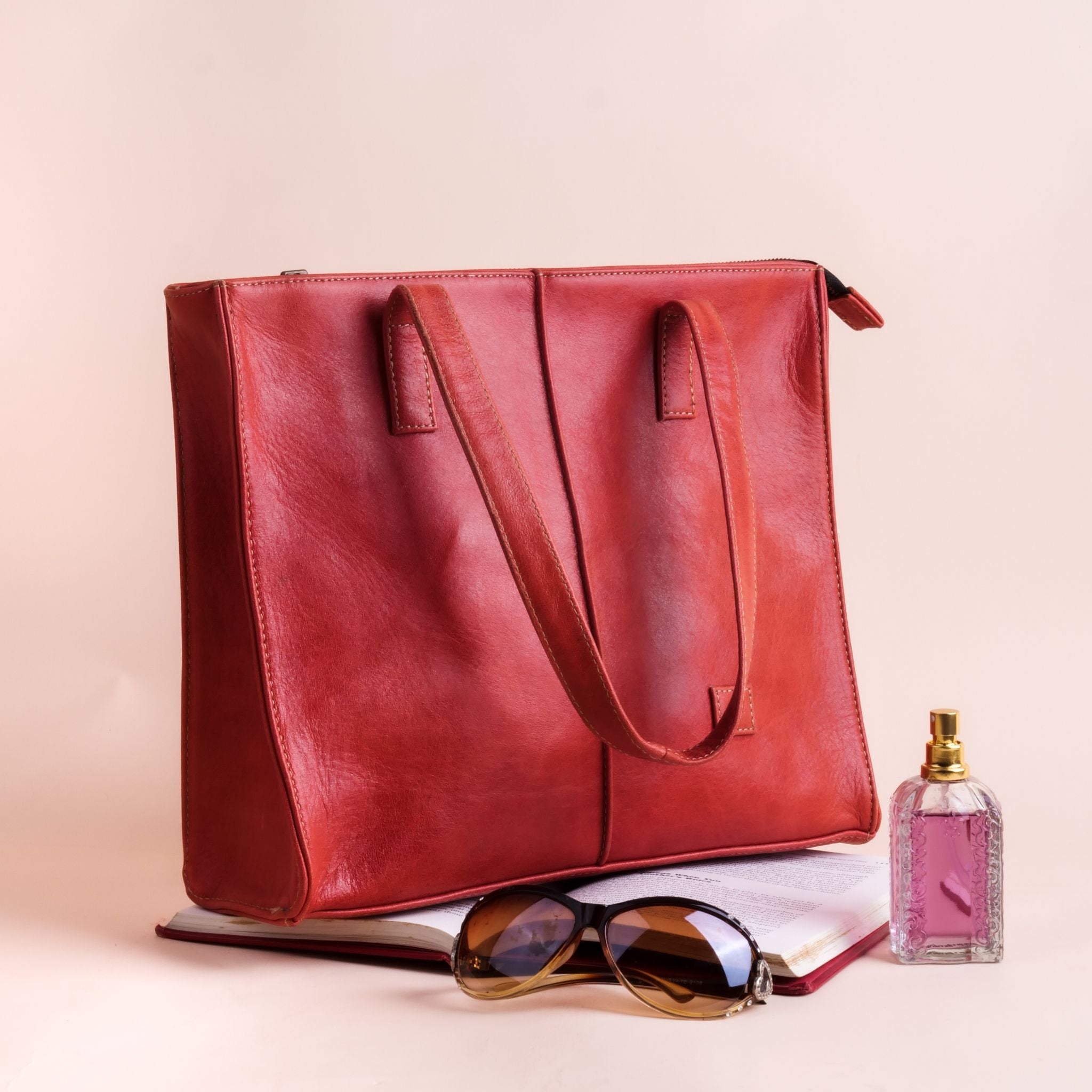 Everyday Women's Leather Zipper Tote Bag in Candy Red, showcasing its spacious design, premium cow leather material, and stylish hardware.