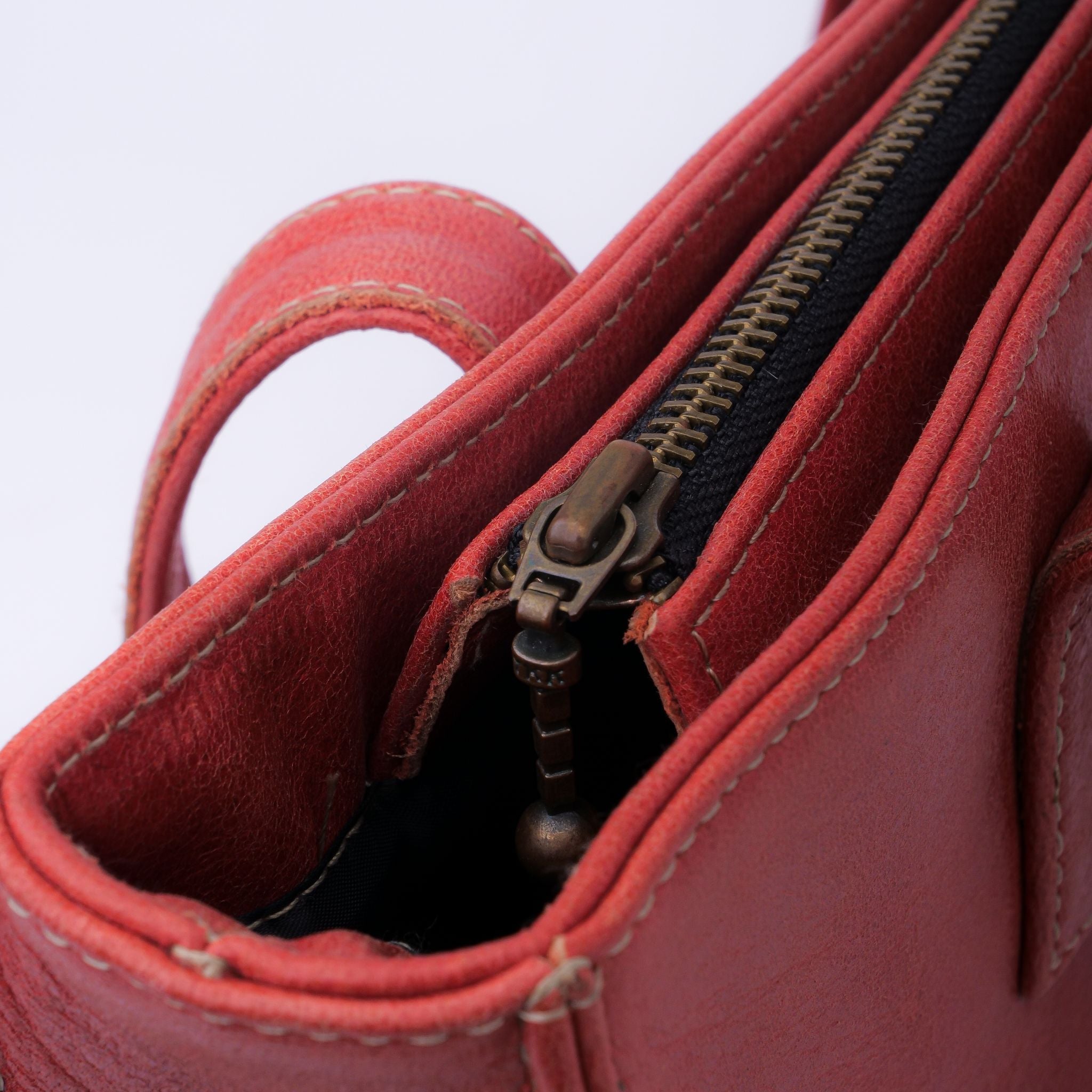 Everyday Women's Leather Zipper Tote Bag in Candy Red, showcasing its spacious design, premium cow leather material, and stylish hardware.