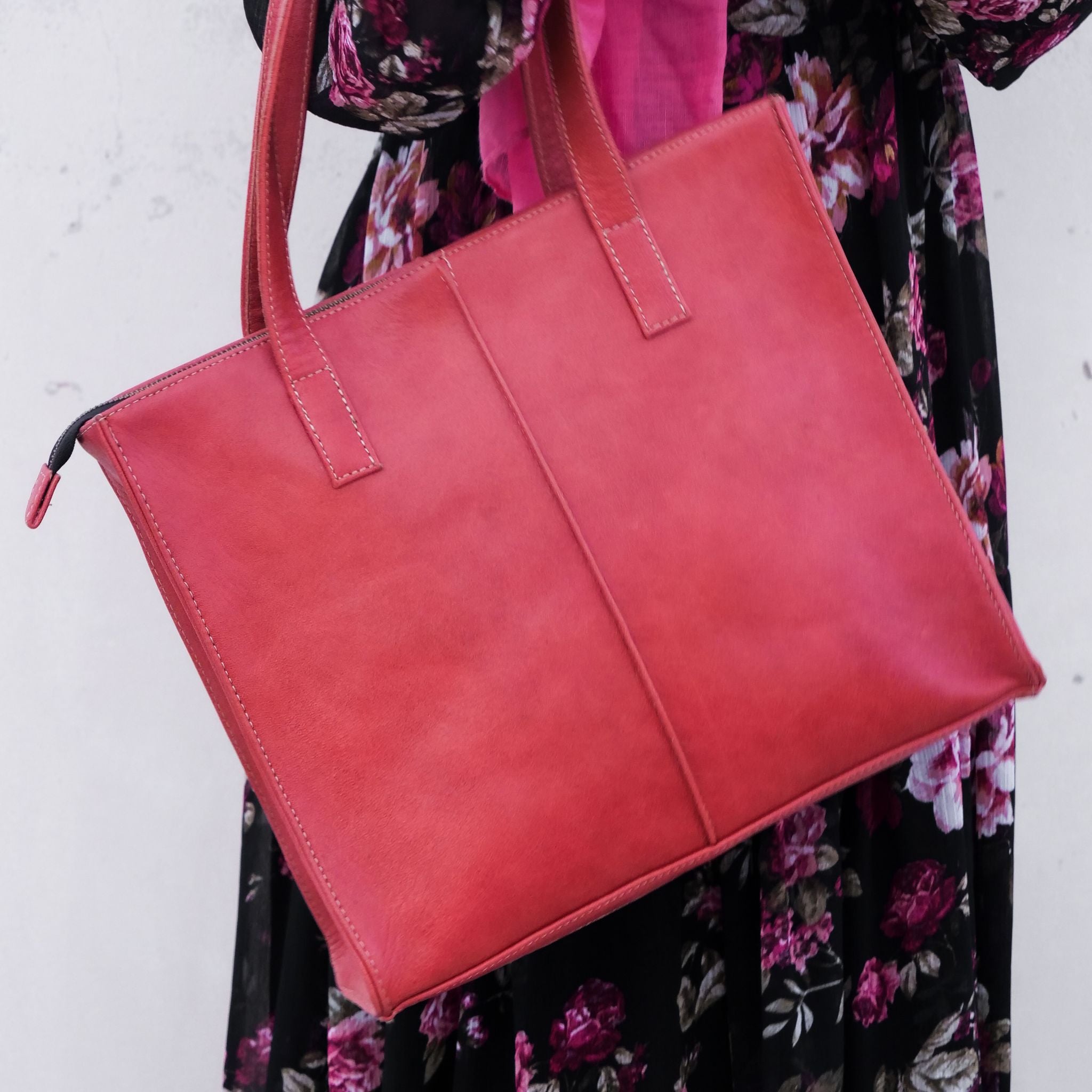 Everyday Women's Leather Zipper Tote Bag in Candy Red, showcasing its spacious design, premium cow leather material, and stylish hardware.