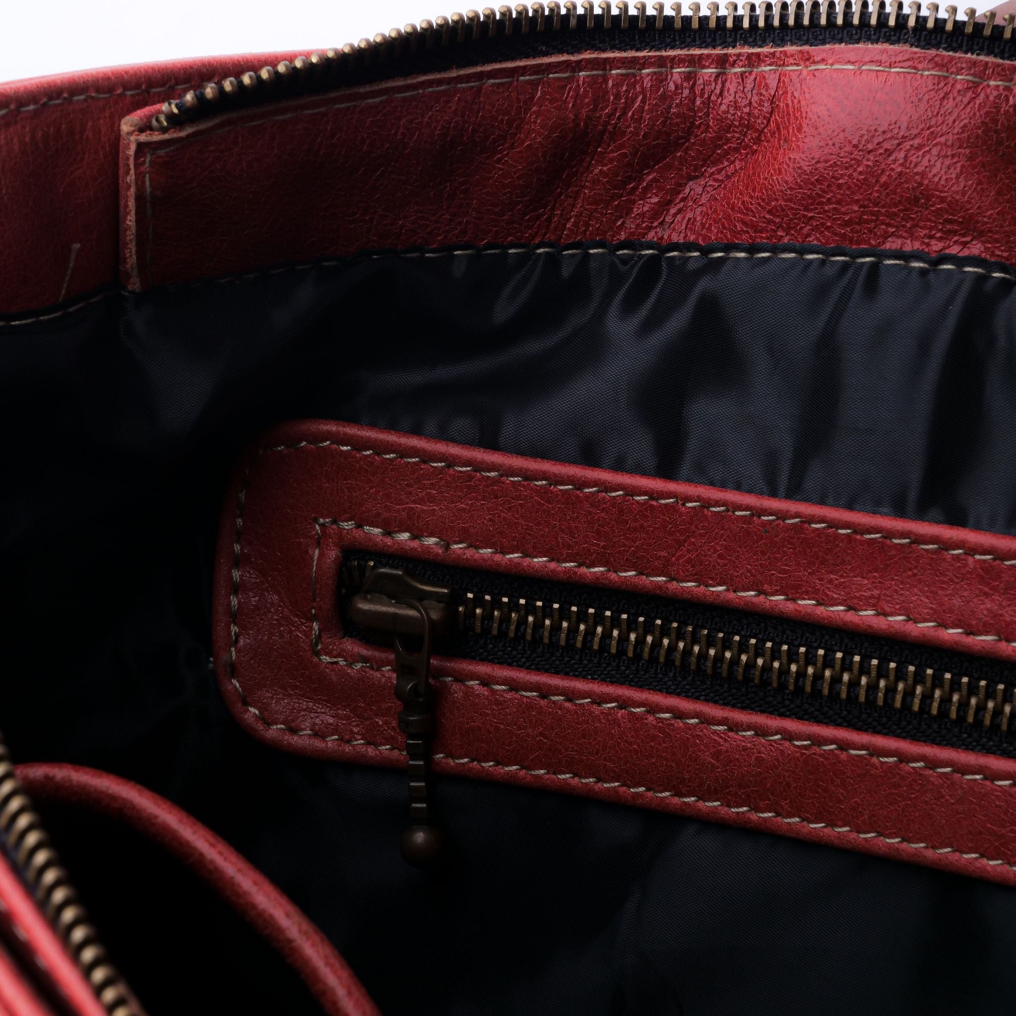 Everyday Women's Leather Zipper Tote Bag in Candy Red, showcasing its spacious design, premium cow leather material, and stylish hardware.