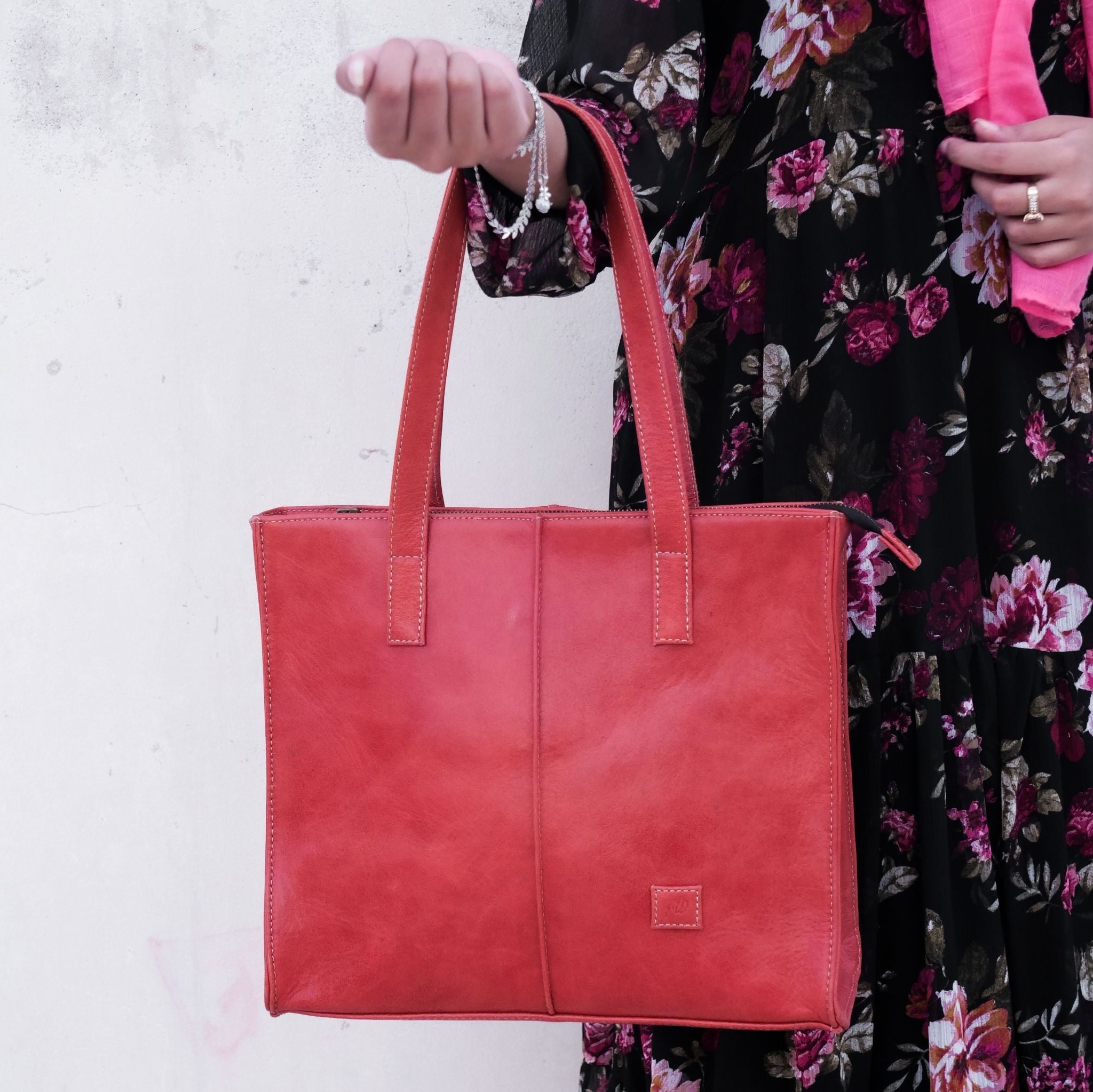 Everyday Women's Leather Zipper Tote Bag in Candy Red, showcasing its spacious design, premium cow leather material, and stylish hardware.