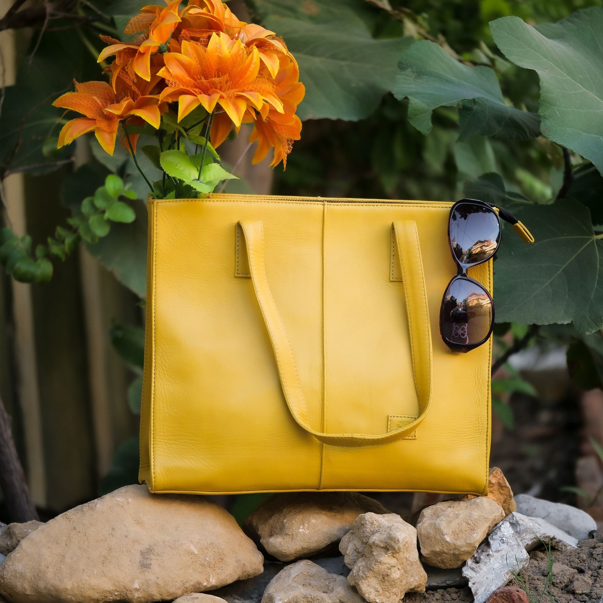Everyday Women's Leather Zipper Tote Bag in Mustard Yellow, showcasing its spacious design and premium cow leather material.