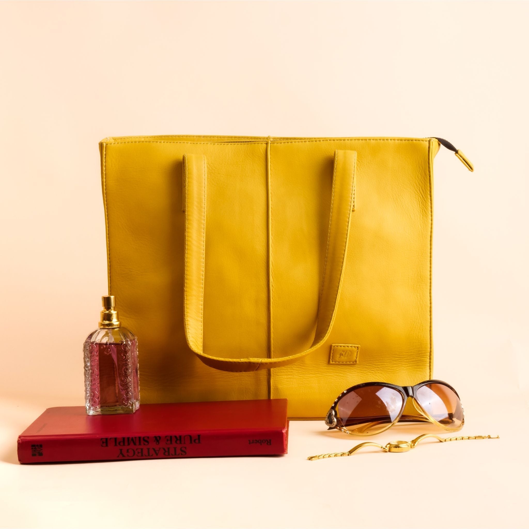 Everyday Women's Leather Zipper Tote Bag in Mustard Yellow, showcasing its spacious design and premium cow leather material.