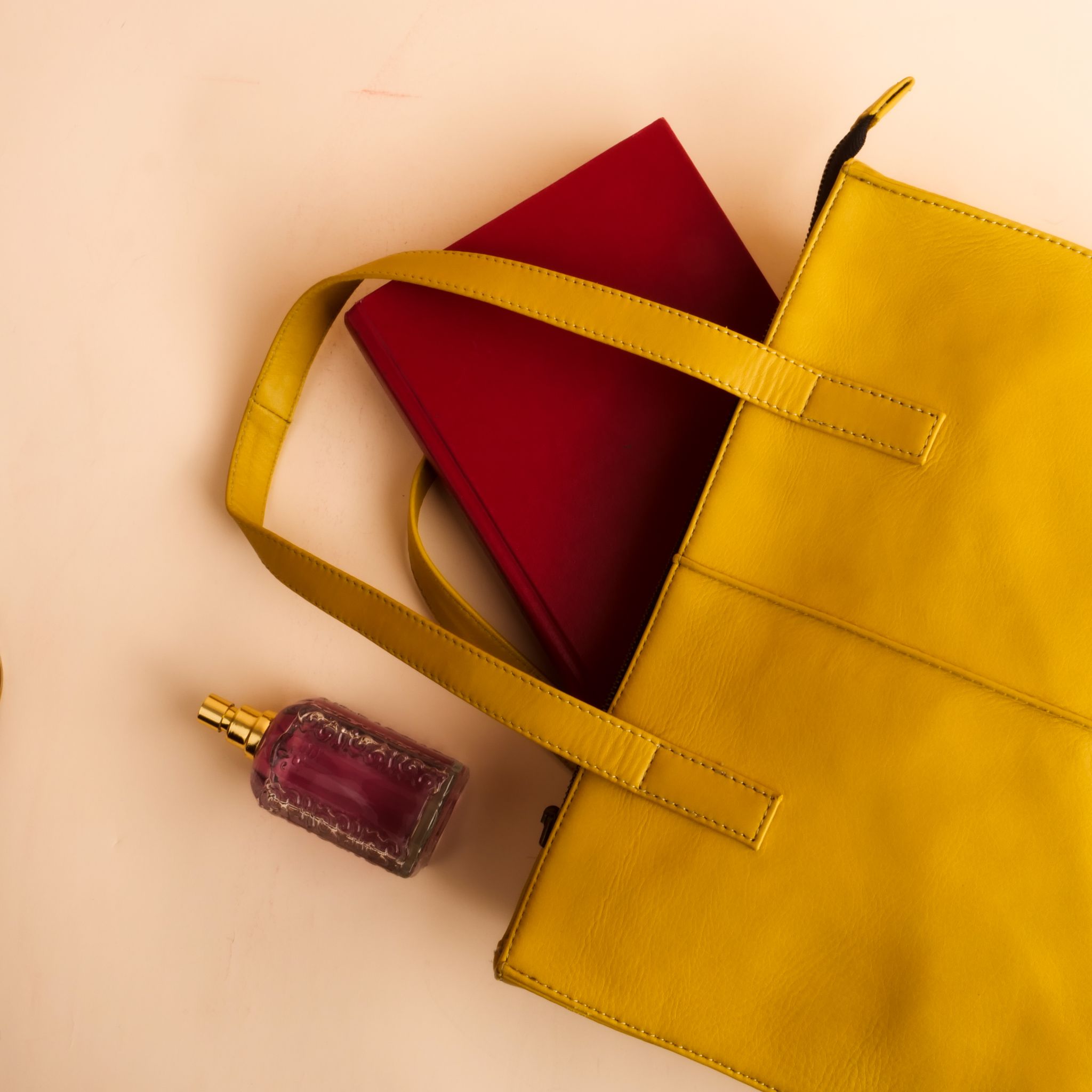 Everyday Women's Leather Zipper Tote Bag in Mustard Yellow, showcasing its spacious design and premium cow leather material.
